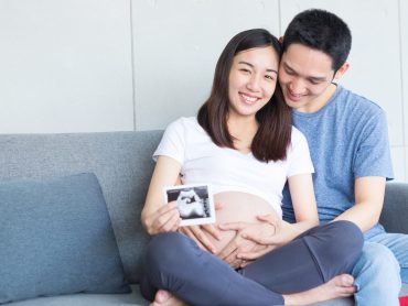 Women and men are showing love and showing ultrasound images of their fetuses. Dad and mom.