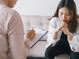 women Asian patients with man psychologist examination consulting and In psychotherapy by the physician in the clinic. psychiatrist concept