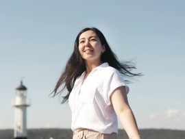 low-angle-smiley-woman-posing