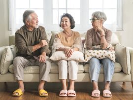 old senior asian friends retired people hapiness positive laugh smile conversation together at living room at nursing home Seniors participating in Group Activities in Adult Daycare Center