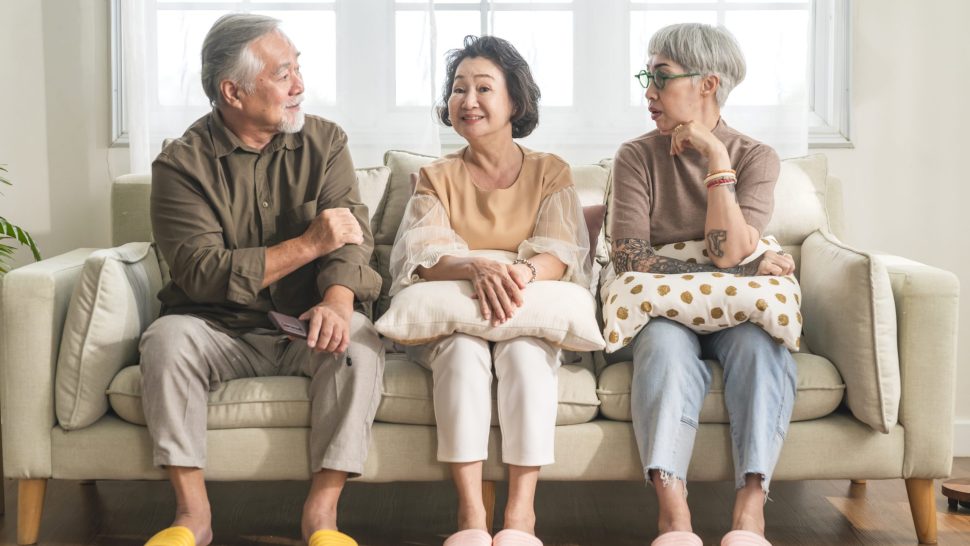 old senior asian friends retired people hapiness positive laugh smile conversation together at living room at nursing home Seniors participating in Group Activities in Adult Daycare Center