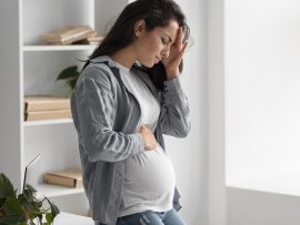 side-view-pregnant-woman-home-having-headache