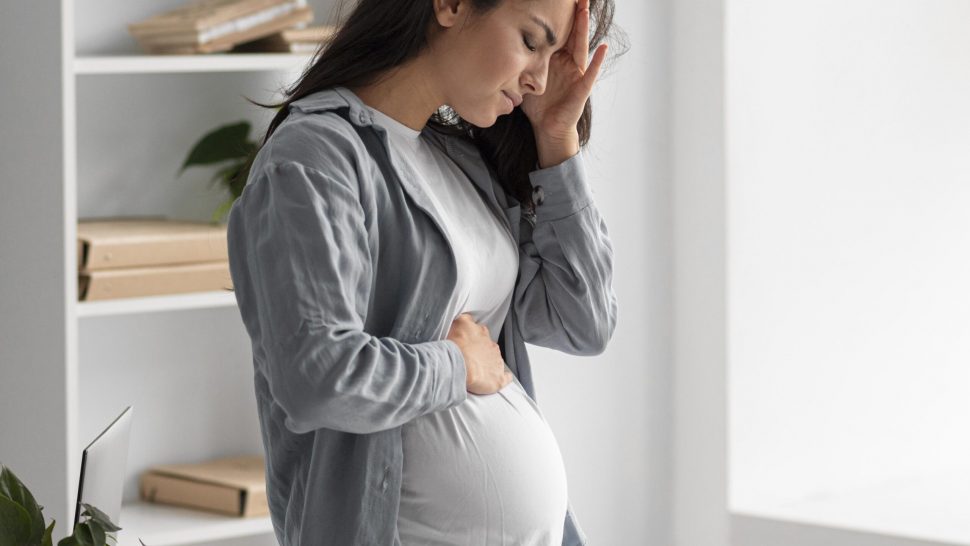 side-view-pregnant-woman-home-having-headache