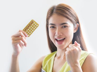 Woman hand holding a contraceptive panel prevent pregnancy