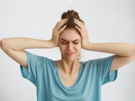 worried-woman-closing-her-eyes-with-hands-head-having-headache_273609-7592